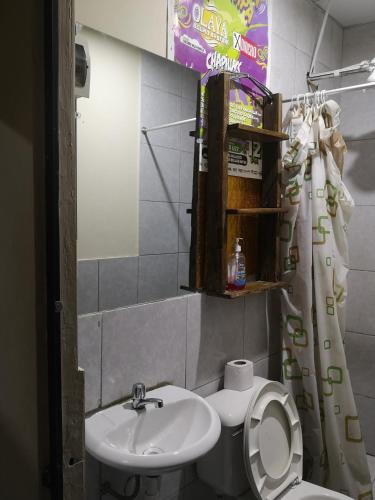 a bathroom with a toilet and a sink at la casa de los amigos in Arequipa