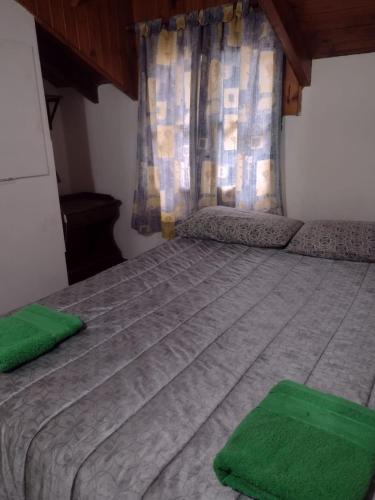 En eller flere senge i et værelse på Elordi