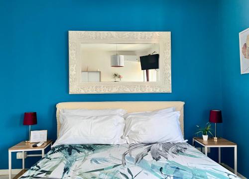 Postel nebo postele na pokoji v ubytování Verona Rooms