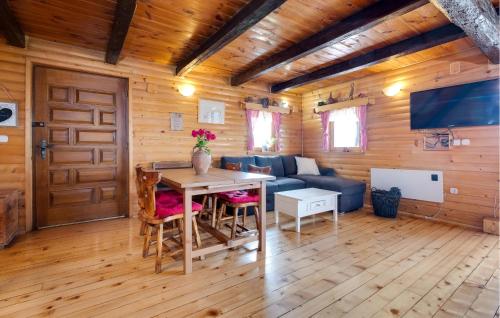 a living room with a table and a couch at Beautiful Home In Samobor With Kitchen in Samobor