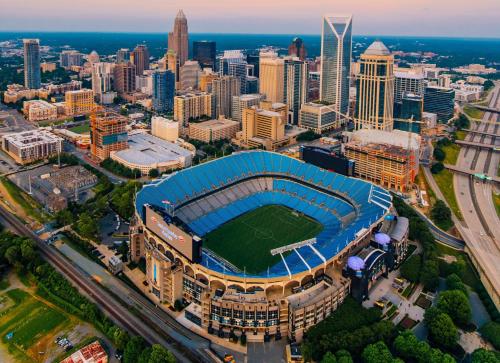 an aerial view of a soccer stadium with a city at Holiday Inn Express & Suites Charlotte North by IHG in Charlotte