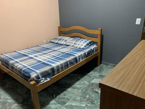 Katil atau katil-katil dalam bilik di Casa no condomínio em Lucena Pb