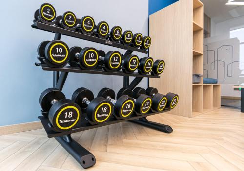 a rack full of dumbbells in a room at Holiday Inn Express Shanghai Pudong Airport by IHG in Shanghai