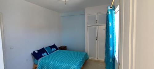 Кровать или кровати в номере Appartements de Vacances Près de la Plage Perle Bleue Saidia