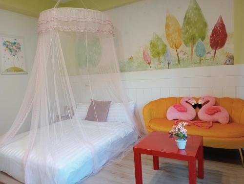 Una cama o camas en una habitación de 宜蘭頭城多一點民宿