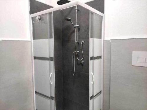 a shower with a glass door in a bathroom at Guest House Ogliastra in Tortolì