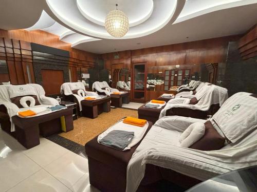 a room with a bunch of beds in it at Lido De Paris Hotel in Manila