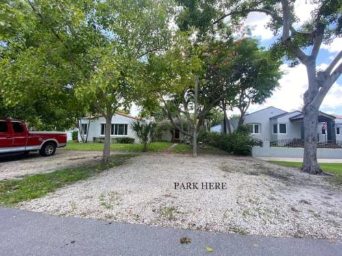 a park here sign in front of a house at Private guest house in the heart of Miami! Surrounded by Miami's HOT spots! in Miami