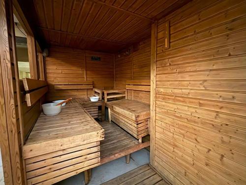 an empty wooden sauna with wooden benches in it at Lido De Paris Hotel in Manila