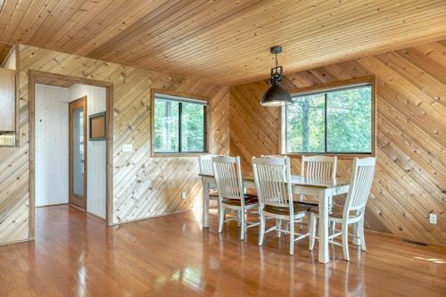 a dining room with a table and chairs at Linden Lakefront Retreat with Kayaks in Innsbrook