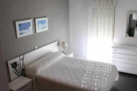 A bed or beds in a room at Apartamento turístico S