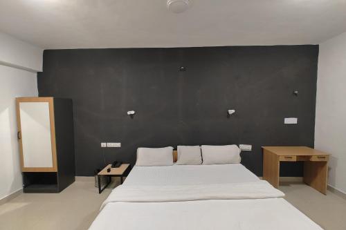 Katil atau katil-katil dalam bilik di Hotel Sai Inn Executive