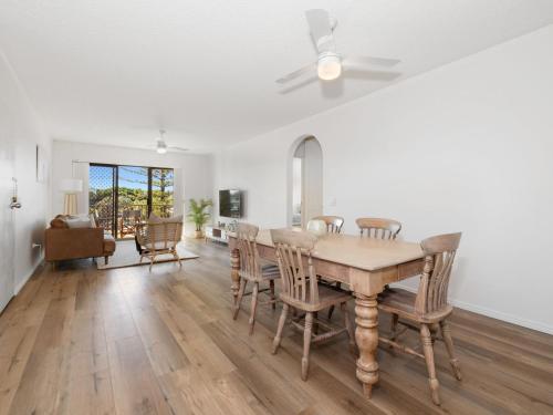 a dining room with a table and chairs at Seaside Getaway on Kingscliff Beach in Kingscliff