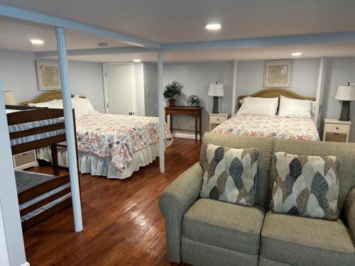 a bedroom with a bed and a couch and a bed at Sea Gem in Old Orchard Beach