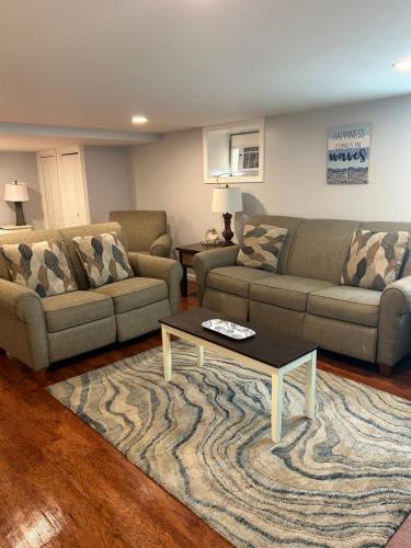 a living room with two couches and a coffee table at Sea Gem in Old Orchard Beach
