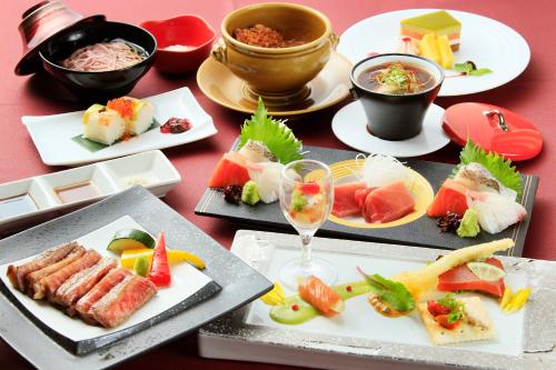a table topped with plates of food and drinks at Bettei Koyoi - Adult Only in Hakone