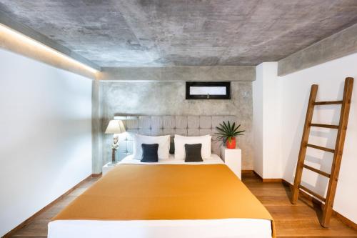 Katil atau katil-katil dalam bilik di Balissimo Suites Seminyak by Betterplace