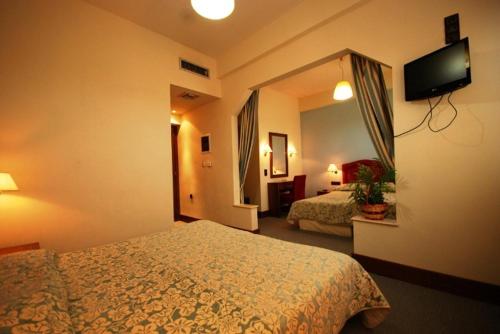 Hotel Elvetiaにあるベッド