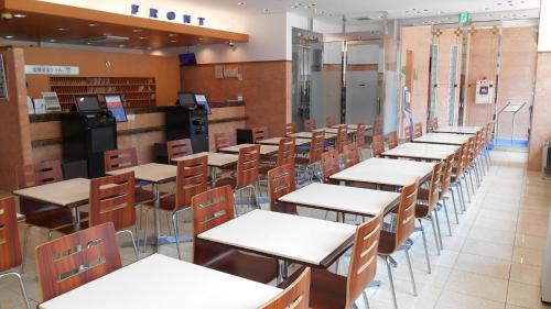 a row of tables and chairs in a library at Toyoko Inn Tokushima eki Bizan guchi in Tokushima
