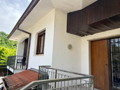 a porch of a house with a wooden door at BB La Collina Botticino in Botticino Sera