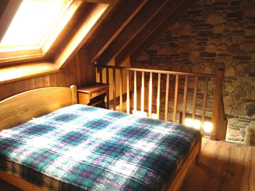 A bed or beds in a room at Gîtes Au Chant des Marmites