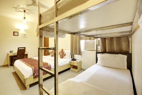 Postel nebo postele na pokoji v ubytování Persona International Hotel Karol Bagh Delhi