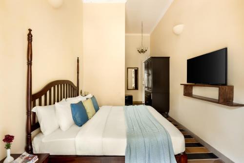 Postel nebo postele na pokoji v ubytování Silva Heritage Resort Goa