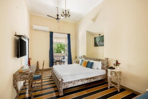 Postel nebo postele na pokoji v ubytování Silva Heritage Resort Goa