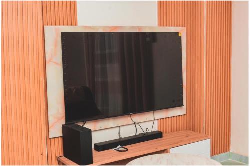 Televisor o centre d'entreteniment de Petit Nid Cosy à Kinshasa