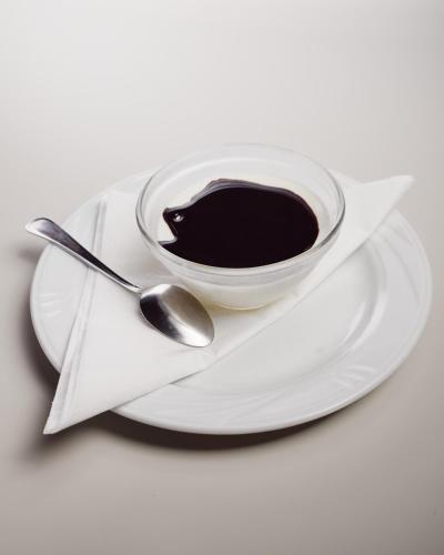 a cup of coffee on a plate with a spoon at Le Copertelle Bed & Breakfast in Serra San Quirico