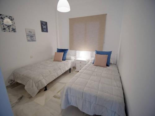 Postel nebo postele na pokoji v ubytování Sea Village Real