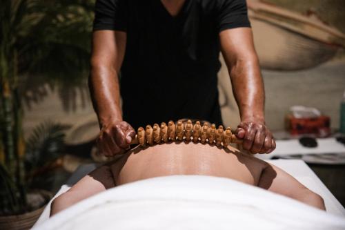 a woman is getting a head massage at The Capital 15 on Orange Hotel & Spa in Cape Town