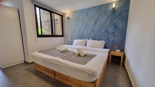 Postel nebo postele na pokoji v ubytování Old Town Guesthouses