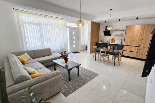 a living room with a couch and a table at Dora in Posušje