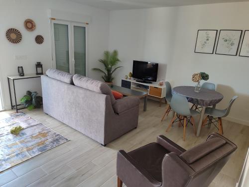 Televízia a/alebo spoločenská miestnosť v ubytovaní Casita con encanto entre viñedos