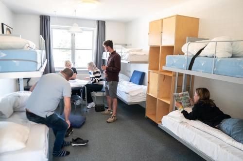 a group of people in a dorm room with bunk beds at Danhostel Silkeborg in Silkeborg