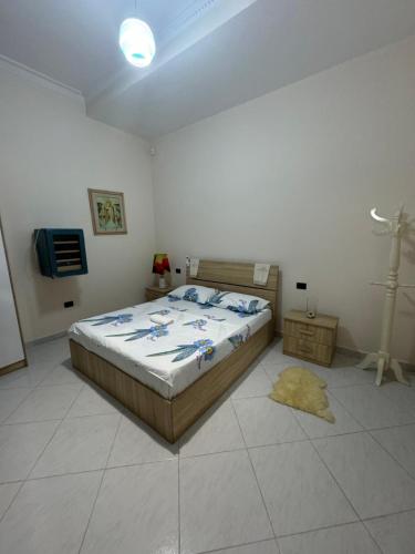 a bedroom with a bed and a tv in it at Vacation Apartments in Hamallaj in Armath