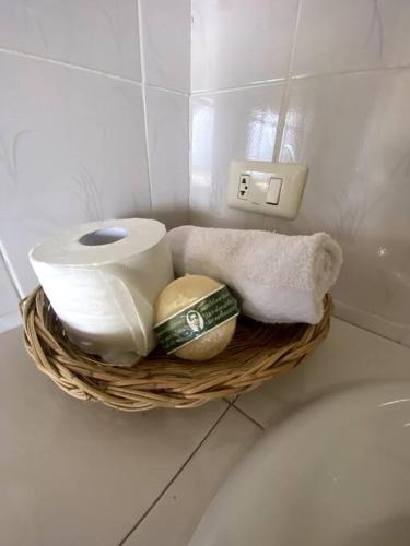 a basket of toilet paper and towels in a bathroom at Spacious Villa with Sunset Sea View in Phra Ae beach