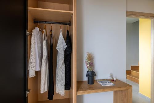 a room with a closet with white clothes at Anadeo Villas & Suites in Exanthia