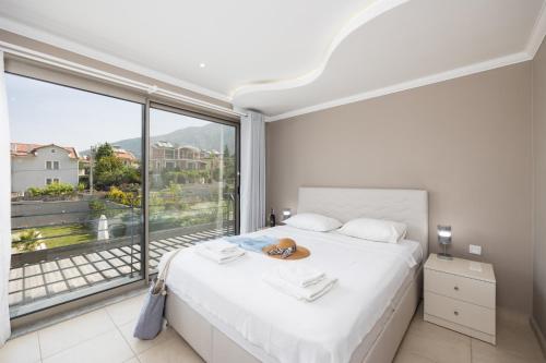 En eller flere senge i et værelse på Villa Moderno B