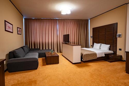 Postel nebo postele na pokoji v ubytování Hotel Aurelia