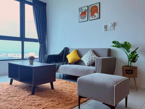 a living room with a couch and a table at Meritus - Perai, Penang in Perai