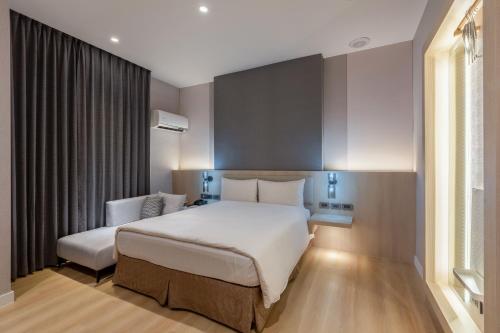 Postel nebo postele na pokoji v ubytování Fu Hsiang Hotel