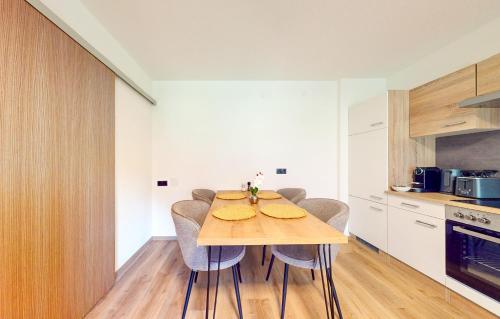 a dining room with a table and chairs in a kitchen at Haus Moritz in Oetz