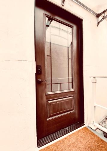 a wooden door with a window on a building at Pasadena Old Town in Pasadena