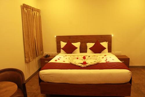 Katil atau katil-katil dalam bilik di Hotel Kairali