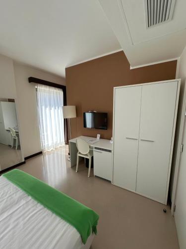 Ein Bett oder Betten in einem Zimmer der Unterkunft Albergo Del Sole