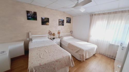 Postel nebo postele na pokoji v ubytování Fonda Toldra