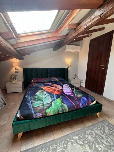a bedroom with a green bed in a room at Medieval House in Viterbo