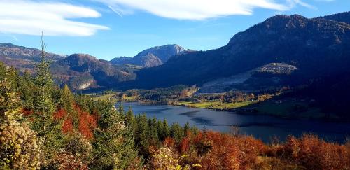 a view of a river in a valley with mountains at Ferienhaus Rosl am Grundlsee in Grundlsee